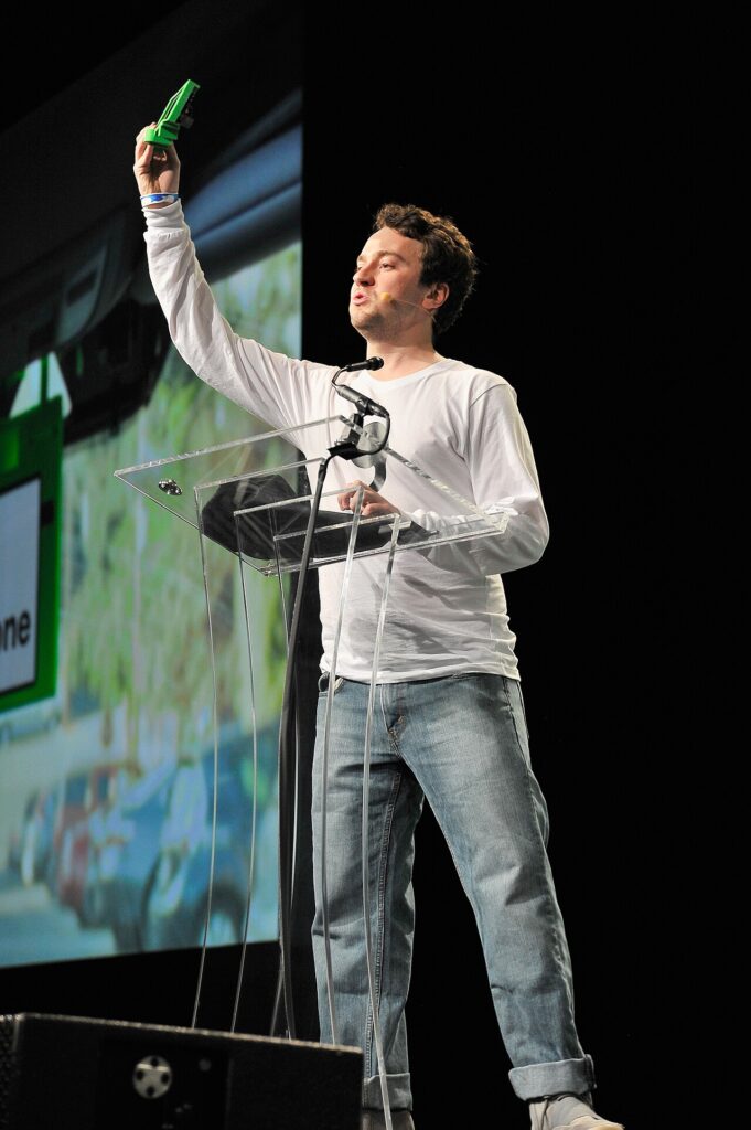 George Hotz speaking on stage at TechCrunch Disrupt SF 2016 about comma.ai, a key part of George Hotz net worth