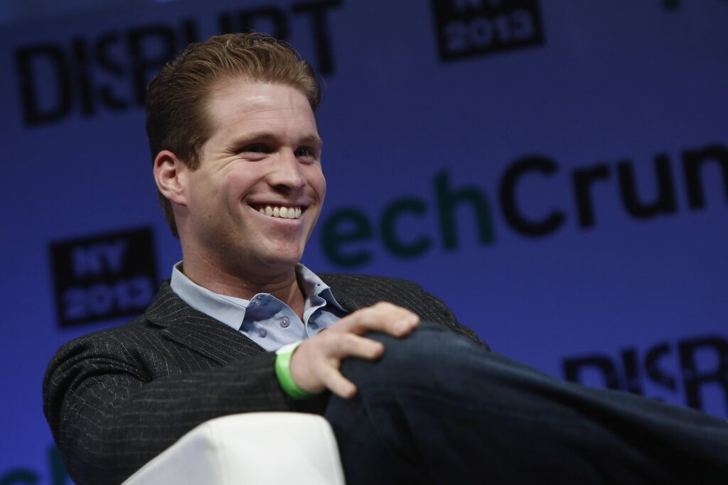 Joe Lonsdale smiling on stage at TechCrunch Disrupt NY, the investor behind Joe Lonsdale net worth