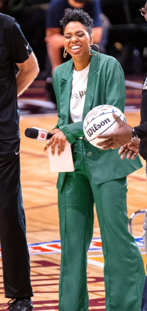 Monica McNutt with an ESPN microphone, the broadcaster behind Monica McNutt net worth