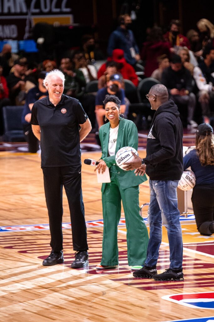 Monica McNutt reporting courtside at NBA All-Star weekend, part of the TV work behind Monica McNutt net worth